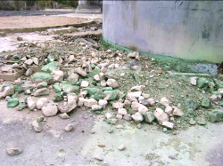 Deposition of copper compounds in the concrete slab and bedrock beneath the remains of the processing plant, Klein Aub mine, Namibia.